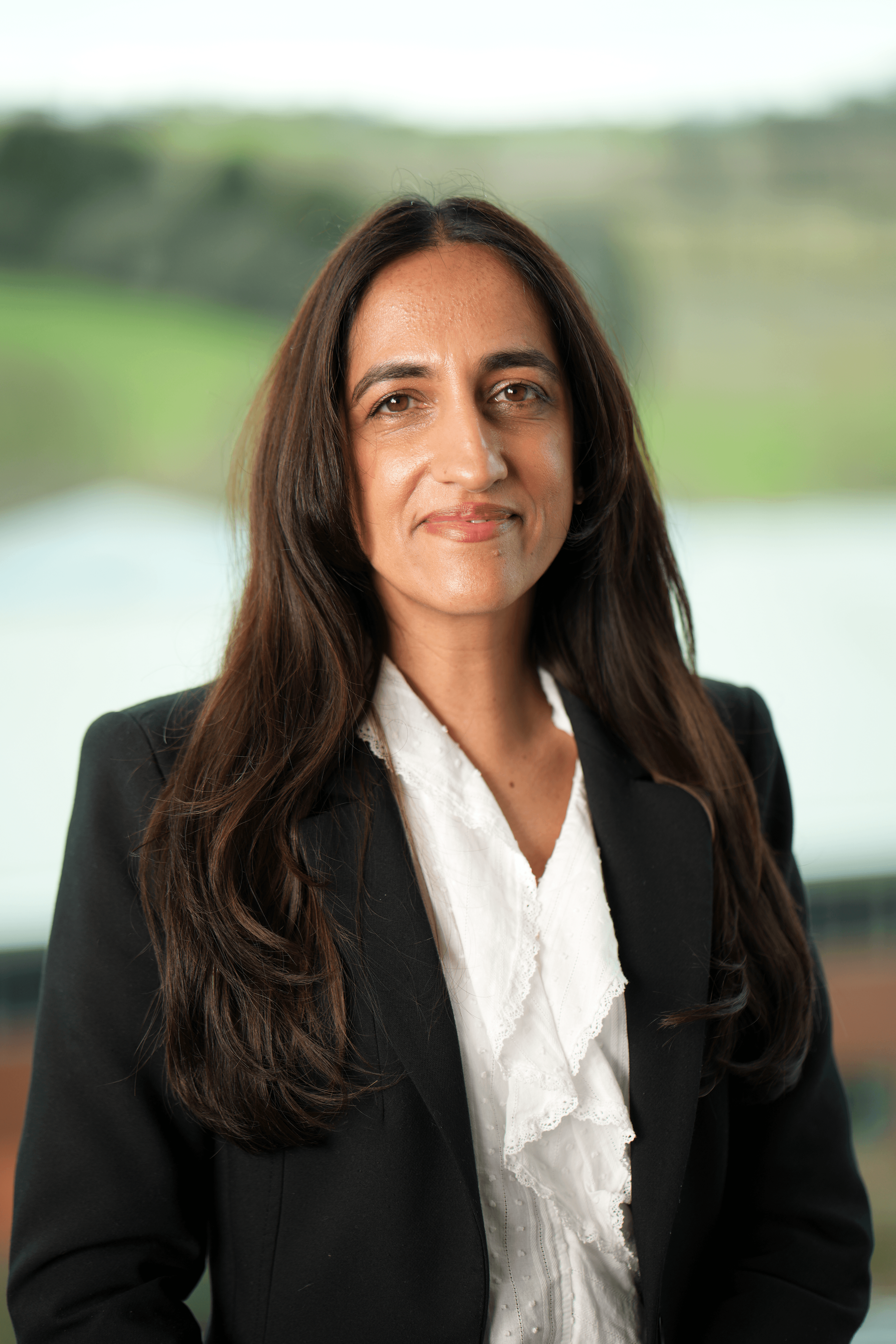 A headshot of Shazadi Stinton, Chief Trust Officer at Trustpilot