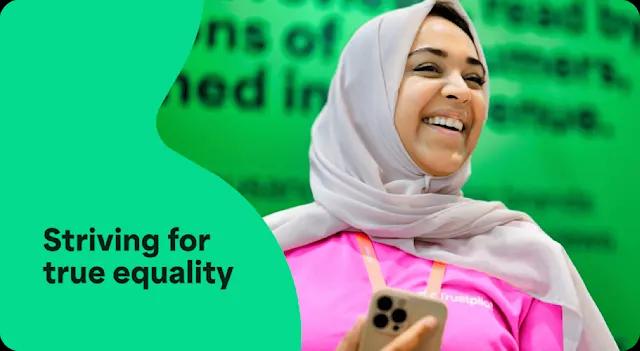 A photo of a woman in a Hijab smiling with an overlay of text that says Striving for true equality